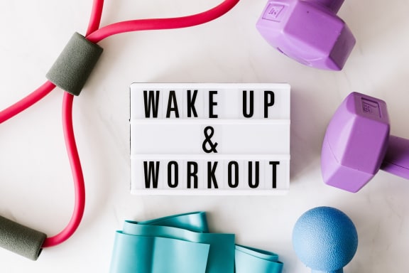 a whiteboard with the words wake up &amp; workout on it