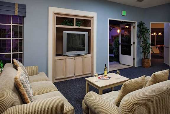 a living room with couches and a coffee table