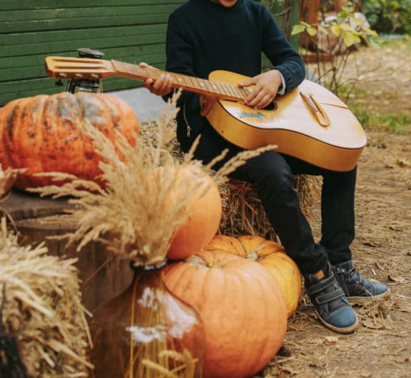 man playing guitar at Oceanwood Apartments, Lompoc, 93436