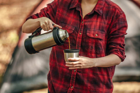 coffee being poured in front of tent at Oceanwood Apartments, Lompoc, CA, 93436