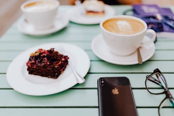 Mobile With Coffe Cup at Oceanwood Apartments, Lompoc