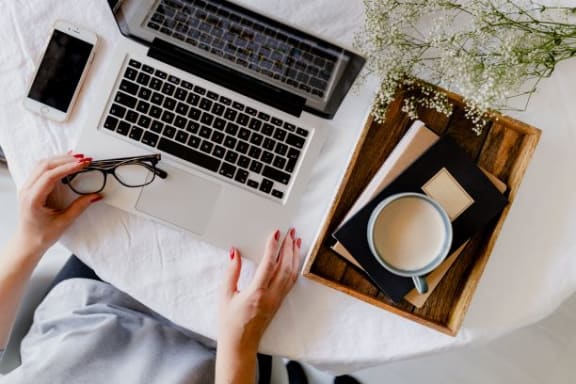 Woman With Laptop at Oceanwood Apartments, California