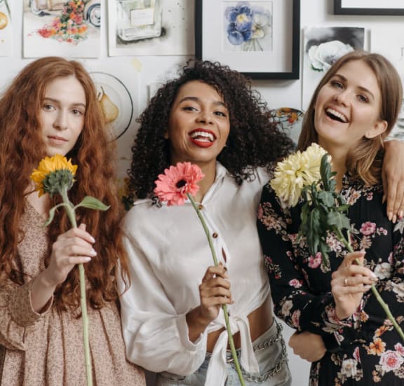Women Holding A Flowers at Ralston Courtyards, Ventura