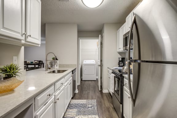 White Appliances In Kitchen at Crestmont at Thornblade, South Carolina