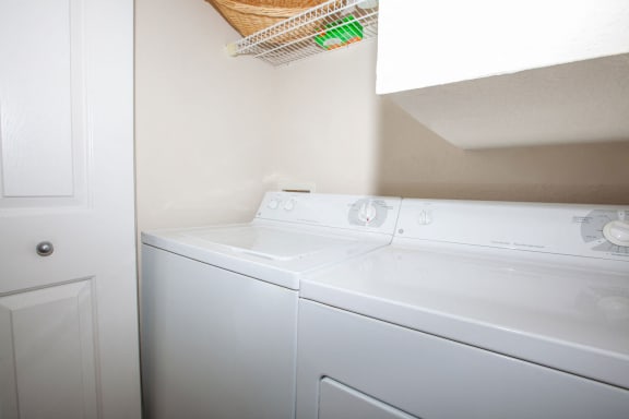 laundry room showing a full size washer and dryer will fit the connections at  Wade Crossing Apartment Homes , Frisco, 75035