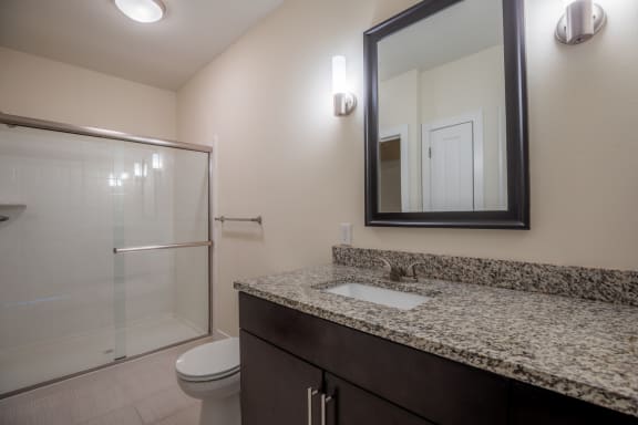 Bathroom with mirror and sinkat West 39th Street Apartments, Missouri, 64111
