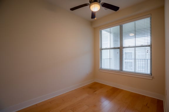 Wooden flooring , ceiling fan and lightat West 39th Street Apartments, Kansas City, Missouri