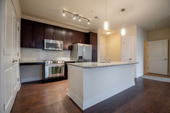 Modern kitchen with cabinetsat West 39th Street Apartments, Missouri, 64111