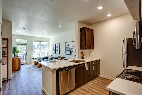Living with open kitchen at Commons at Sylvan Canyon Apartments, Oregon, 97221