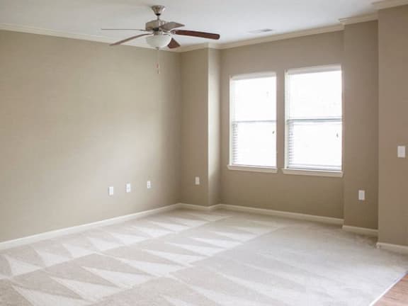 Room with high ceiling, fan, and plush carpet at Fenwyck Manor Apartments, Chesapeake, VA, 23320