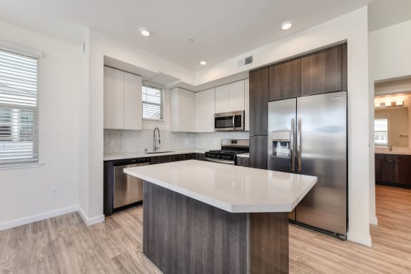 Kitchen Area with Countertop, Refrigerator and Ceiling Lights at Morgan Ranch Apartments, Morgan Hill, 95037