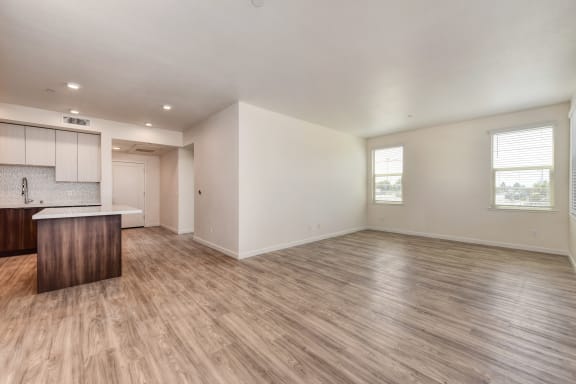 Living Room with Wood Inspired Floor and Windows at Morgan Ranch Apartments, Morgan Hill, 95037