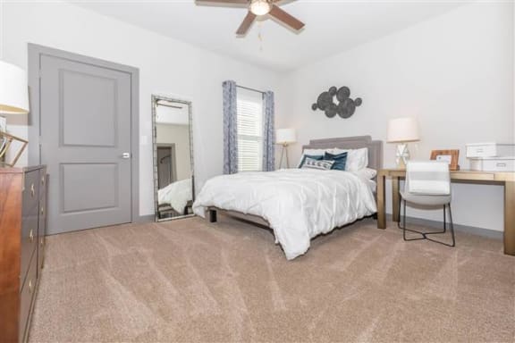 Bedroom with Large Bed at One White Oak Apartments, Cumming, GA