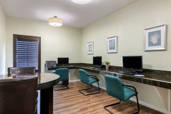 Business Center with High Top Table and Chairs and Granite Counter with Computers  and Green Chairs