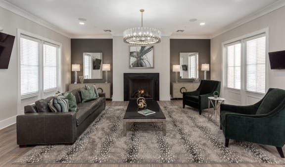 Clubhouse with a couch, chair and fireplace at Annandale Apartment Homes, Murfreesboro, TN