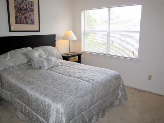 Comfortable Bedroom With Large Window at Holly Cove Apartments, Florida