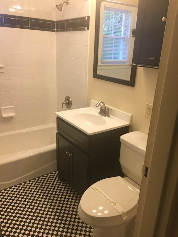 Light in bathroom with sink at Rivercrest Apartments, Piscataway
