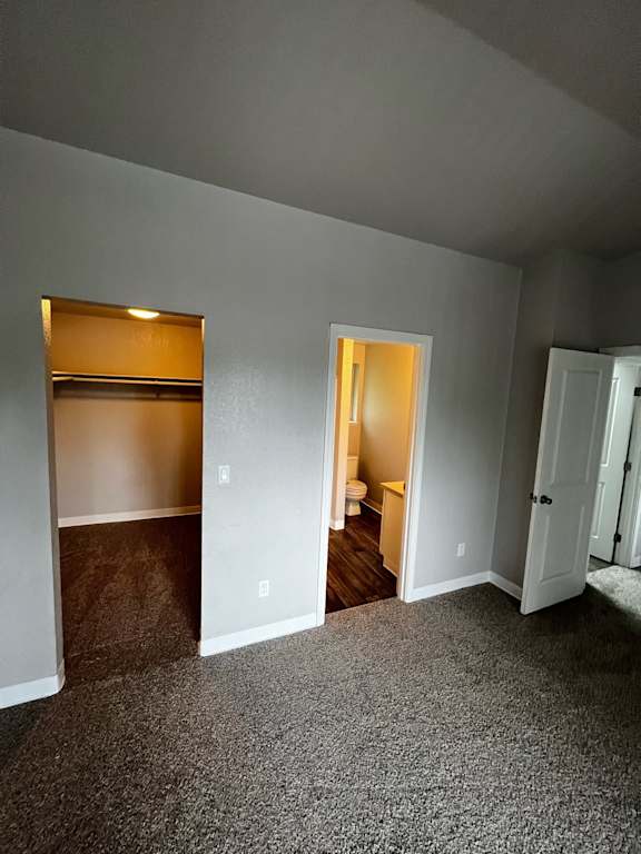 View of Walk-in closet (L) and Master Bath (R) in Madrona unit