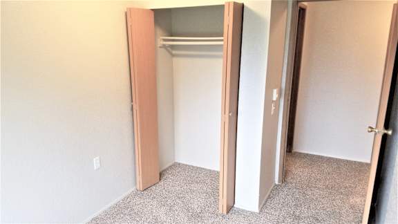 Closet in secondary bedroom in Willow unit