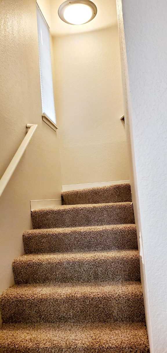 Staircase to upper level in Alder unit