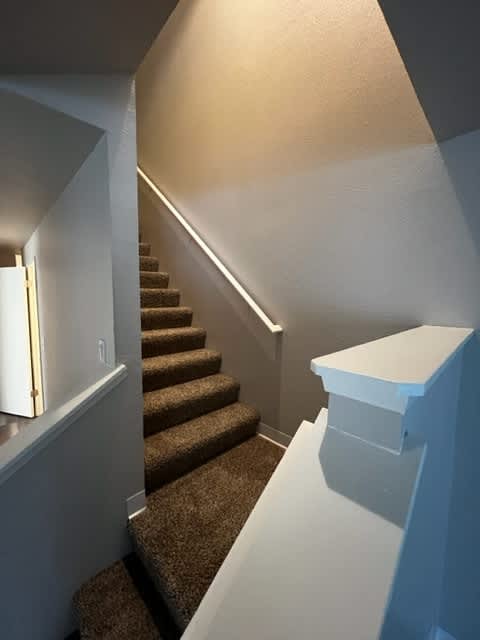Staircase to upper level in Evergreen unit