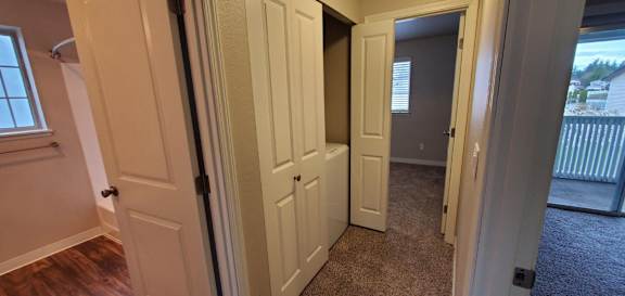Hallway to Laundry closet and Secondary Bathroom in Waterleaf unit