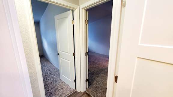 Another Secondary Bedroom (L) and Master Bedroom (R) in Oak unit