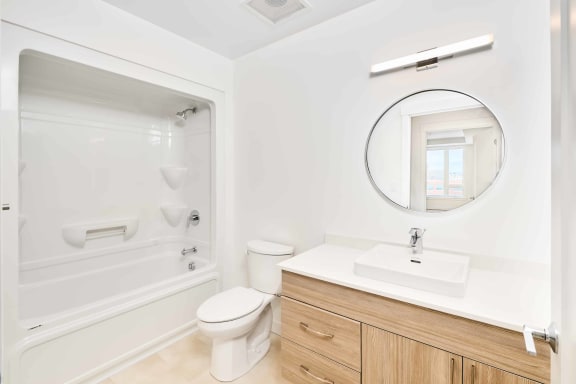 a bathroom with a sink and a toilet and a shower