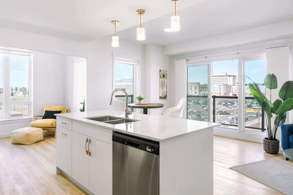 kitchen island with sink and dishwasher
