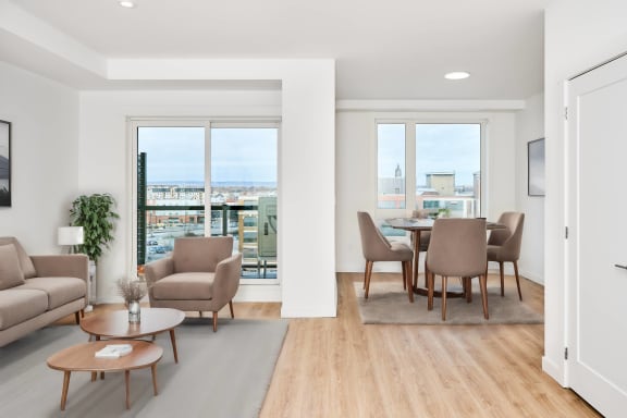 an open living room and dining room with a table and chairs