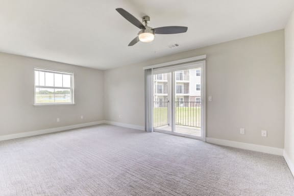 Enlarged living room with plush carpeting at Eagle Ridge Apartment Homes, Traverse City, Michigan