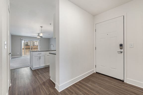 Entry way leading to kitchen with hard surface flooring at Eagle Ridge Apartment Homes, Traverse City, MI