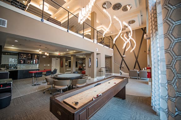 Clubroom With Shuffleboard at Link Apartments® Brookstown, Winston Salem, NC, 27101