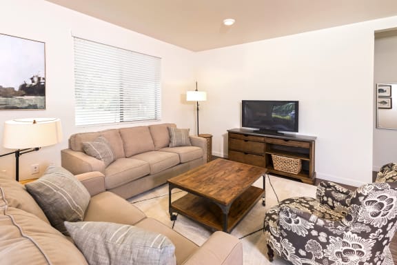Living Room With TV at Park Square at Seven Oaks, Bakersfield, CA, 93311