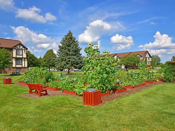Outdoor community gardens at Charter Oaks Apartments in Davison, MI