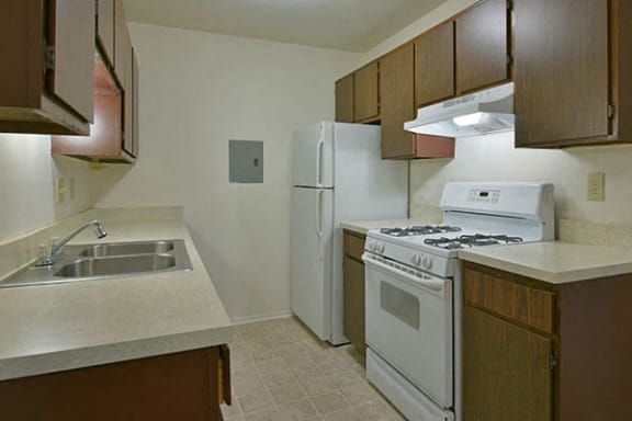 Well Equipped Kitchen with White Appliances at Cordoba Apartments, Farmington Hills