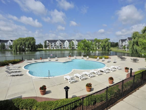 Expansive Outdoor Swimming Pool with Large Sundeck and Lake Views at Northport Apartments, 48044