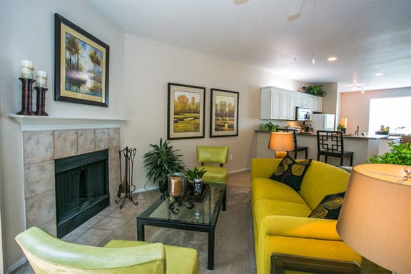 Brick Wood-Burning Fireplace in Spacious Living Room at 8911 Apartments
