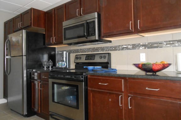 Espresso Finished Custom Cabinets at The Residences At Hanna Apartments, Ohio, 44115