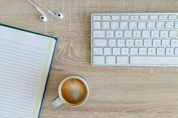 coffee_keyboard_earphones_on_desk at Sumida Gardens Apartments, Santa Barbara