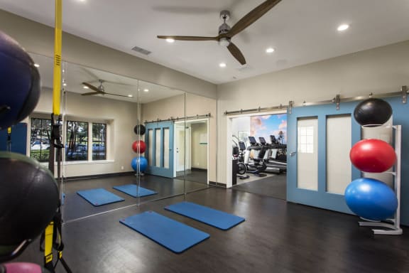 a gym with yoga mats and exercise balls and a ceiling fan at Pointe Niguel, Laguna Niguel, 92677