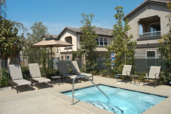 Umbrella Shaded Chairs By Pool at Sonoma at Mapleton, California