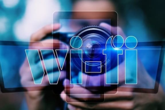 Person holding phone with Wifi at Centerville Manor Apartments, Virginia Beach, VA