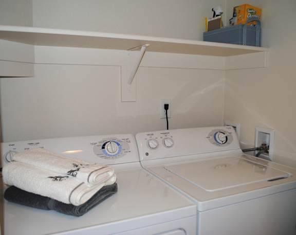 White washer and dryer at Commons at Sylvan Highlands Apartments, Oregon, 97225
