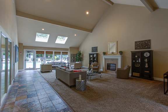 Living room with couch and table at Commons at Creekside Apartments, Hillsboro, 97123