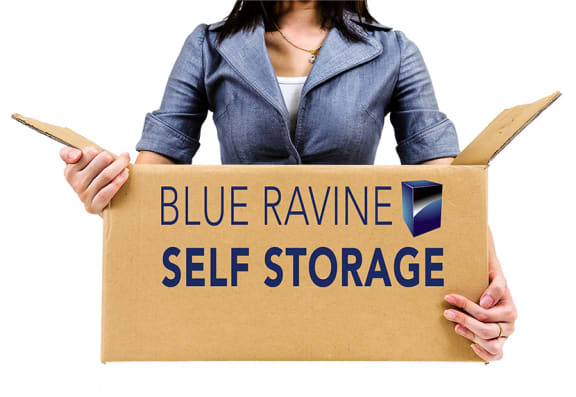 Woman with Storage Boxes at BLUE RAVINE SELF STORAGE, California
