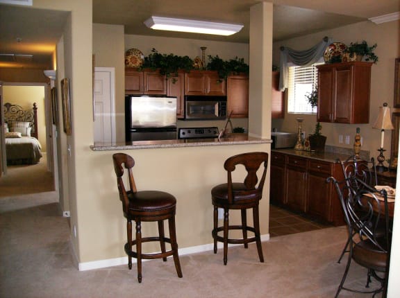 View of kitchen with Bar seating and dining area Castellino at Laguna West Apartments For Rent