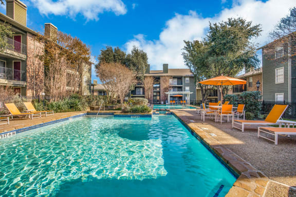 Swimming Pool with Lounge Seating at Newport Apartments, Irving