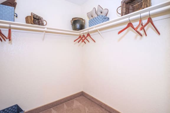a display of clothes and shoes in a store with white walls at Desert Bay Apartments, Laughlin, Nevada