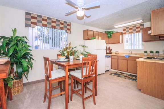 a kitchen and dining room with a table and chairs at Desert Bay Apartments, Laughlin, NV